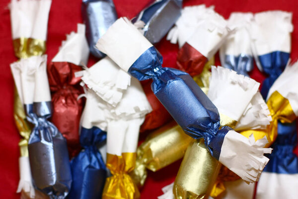 Pile of candies on red table background