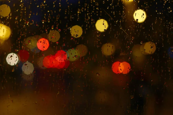 Wet Glass Bright Colourful Bokeh Spots Distance — Stock Photo, Image