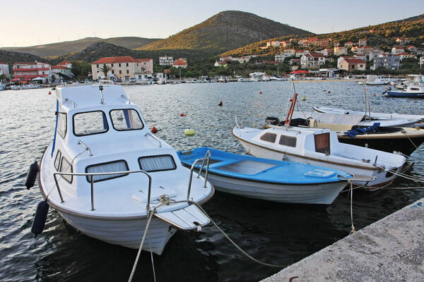 scenic view of harbor and boats close to town