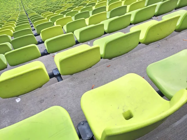 green plastic seats on the sport stadium