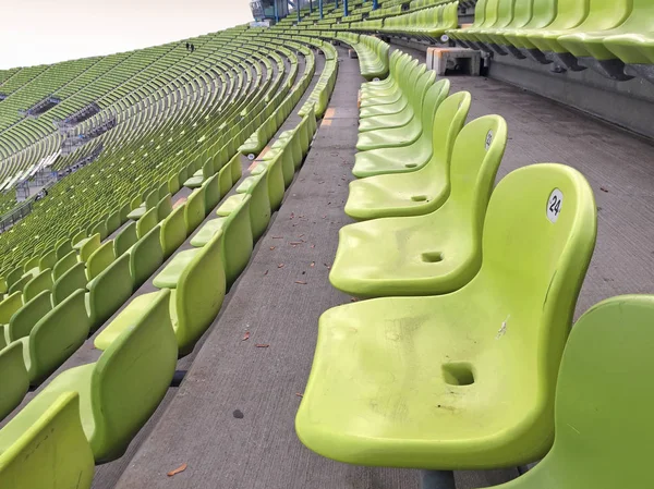 green plastic seats on the sport stadium