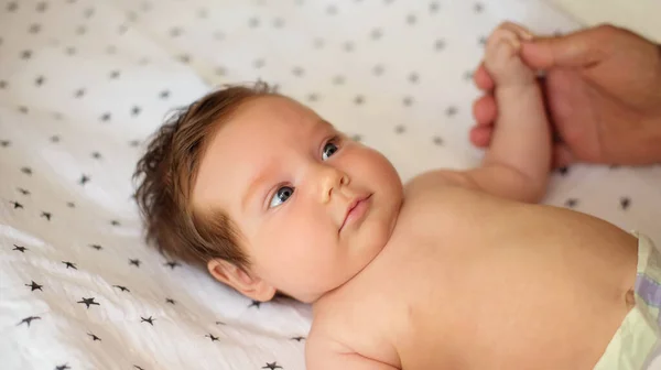 Infant Baby Girl Surprised Face Lying Back Blanket Holding Hand — Stock Photo, Image