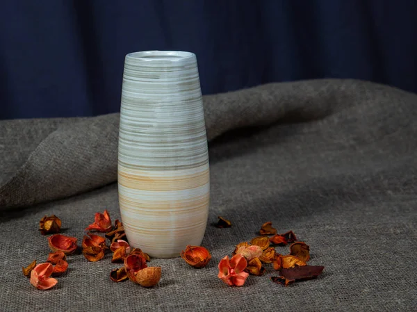 empty vase with dried flower petals