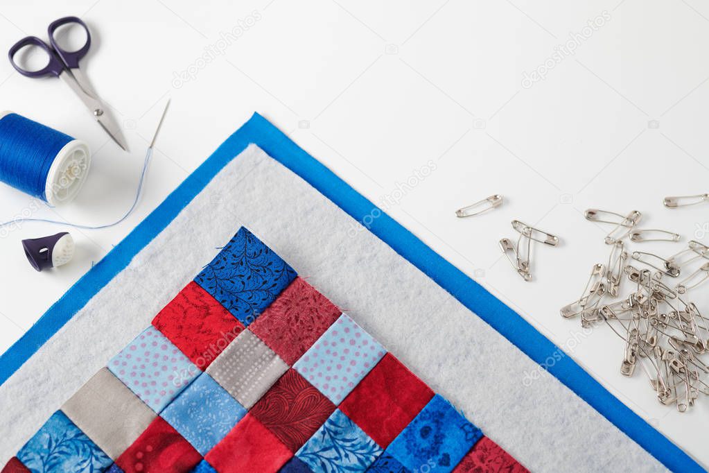 Assembling of a quilt sandwich, curved basting pins and sewing accessories
