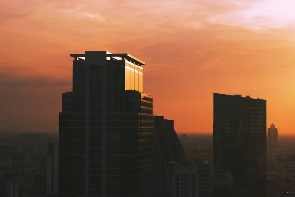 Building in the central business district of the city and sunset background — Stock Photo, Image