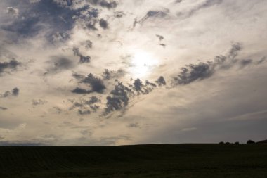 Beautiful clouds over the field landscape