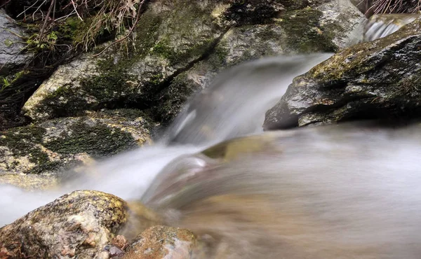Small waterfall in forest close up