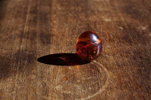 close up view of little ball on wooden background