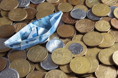 sikke arka plan, mali kavram üzerinde tekne şeklinde para banknot 