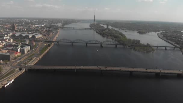 4k aerial skyline view panorama of Daugava river, bridges, cruise ships and city buildings — Stock Video