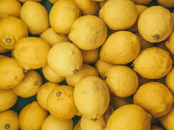 Healthy fruits, lemon fruits background many lemon fruits in store