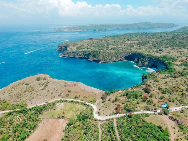 Aerial drone view of cliff, ocean, beach, shore In Nusa Penida, Bali, Indonesia with amazing blue ocean