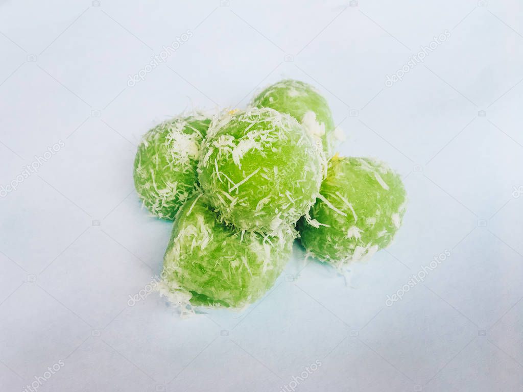 Klepon, Indonesian traditional food delicacy. Sweet rice balls stuffed with palm sugar isolated on white background