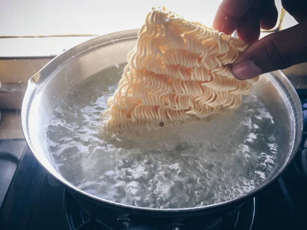 Man Putting Noodles Water Close — Stock Photo, Image