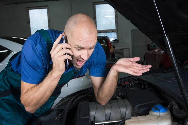 Young Car Service Technician Calling While Repair Car Engine Motor — Stock Photo, Image