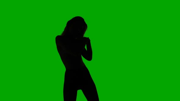 Dancing young slim woman, silhouette — Stock Video