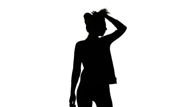 Isolated silhouette of dancing slim girl — Stock Video