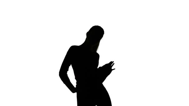 Isolated silhouette of dancing young slim woman — Stock Video