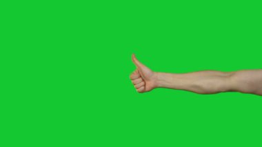 Erkek başparmak jest yeşil zemin üzerine