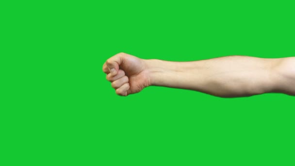 緑の背景に男性の拳 — ストック動画