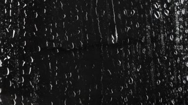 Siyah arka plan üzerine sıvı damla doku