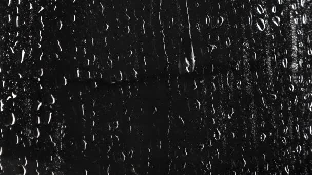 Textura de gotas líquidas sobre fondo negro — Vídeos de Stock