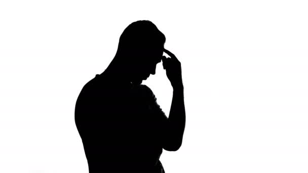 Silhouette of thinking young man — Stock Video