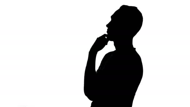 Silhouette of listening young man — Stock Video