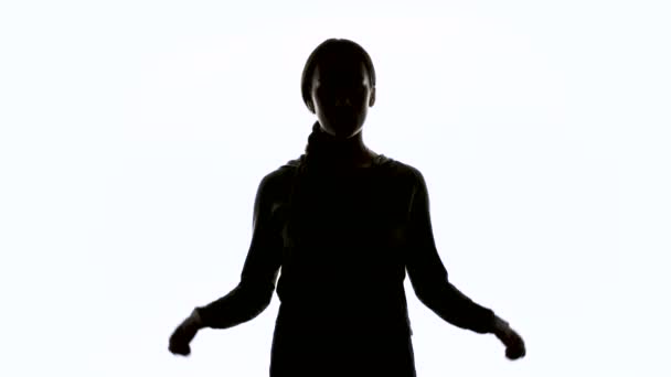 Silhouette of woman wearing hood — Stock Video