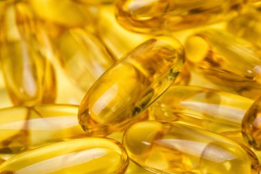 Fotoğraf arka plan sarı balık yağı kapsül