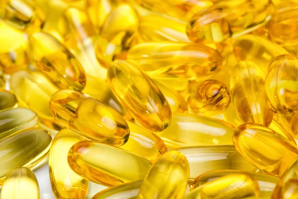 Image de fond de jaune huile de poisson saine dans les médicaments — Photo