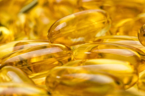 Immagine sfondo di olio di pesce giallo in capsule — Foto Stock