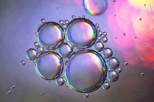 Photo holographic oil bubbles on colorful background — Stock Photo, Image