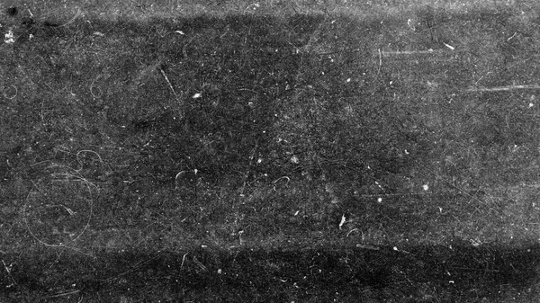 Textura de película vieja en fondo negro con arañazos blancos — Foto de Stock