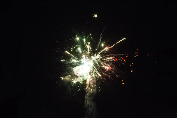 Shot of colored fireworks on the black sky in summer — Stock Photo, Image