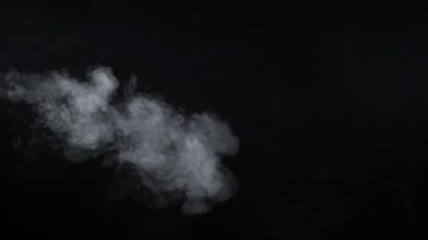 Shooting of white cigarette vapor on black background — Stock Video