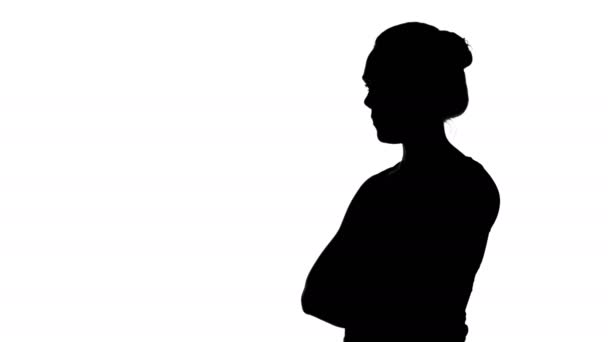 Girls silhouette with arms crossed on white background — Stock Video