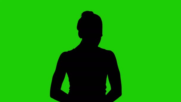 Mädchen Silhouette mit Händen nach oben auf grünem Hintergrund — Stockvideo