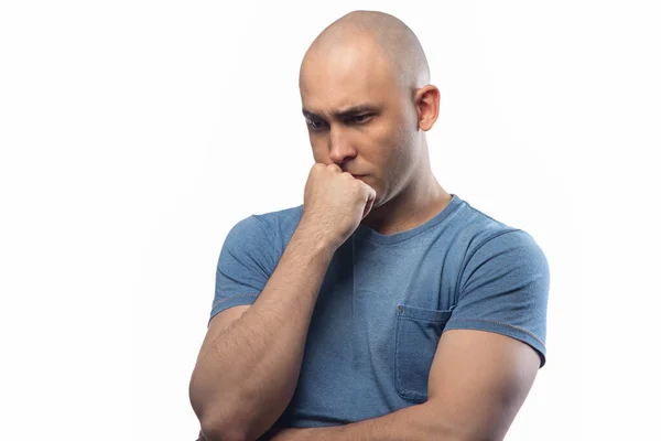 Photo of young shaved serious man on white background — ストック写真