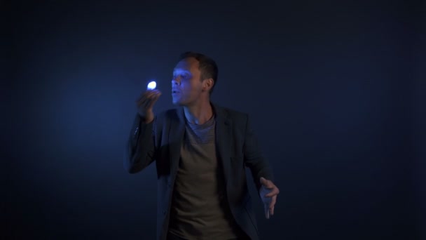 Trick of illusionist man with lights — Stockvideo