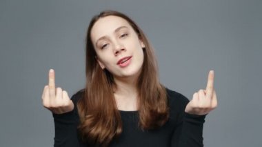 Video of young girl in black shirt showing fuck finger, close-up