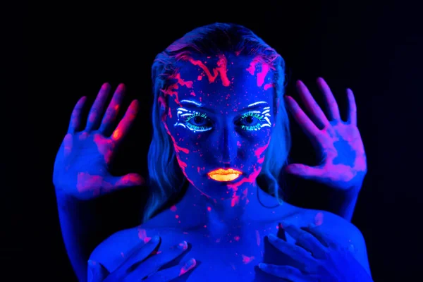 Photo of young girl with fingers near face in neon — Stock Photo, Image