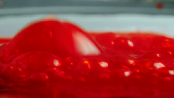 Shooting of bubbled red oozing, close-up — Stock Video