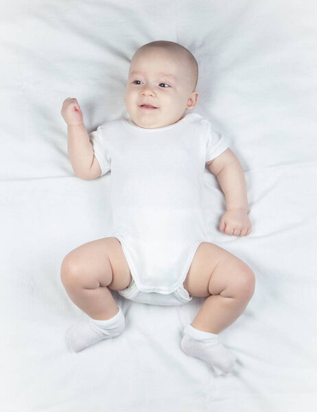 Image of a six-month-old baby on a white background