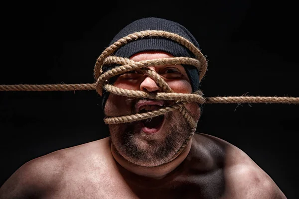 Photo of binded fat man with rope on face — Stock Photo, Image