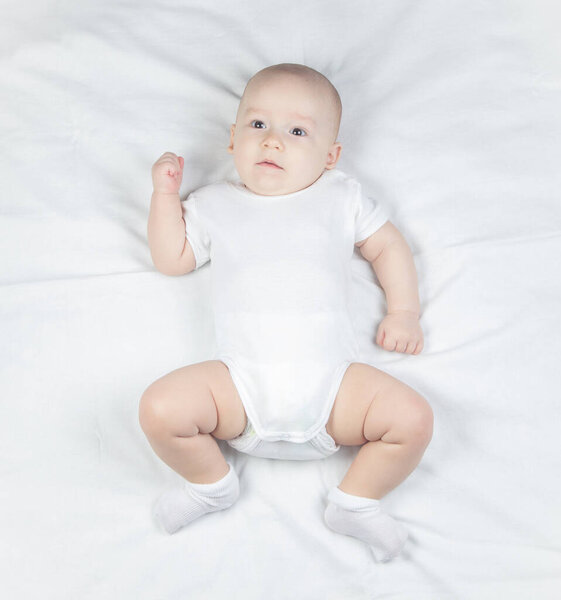 Photo a six-month-old baby on a white background