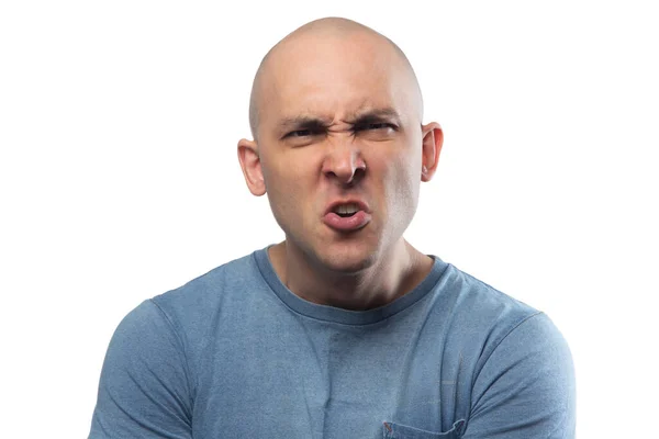 Photo of young bald aggressive man in blue tee shirt — 스톡 사진
