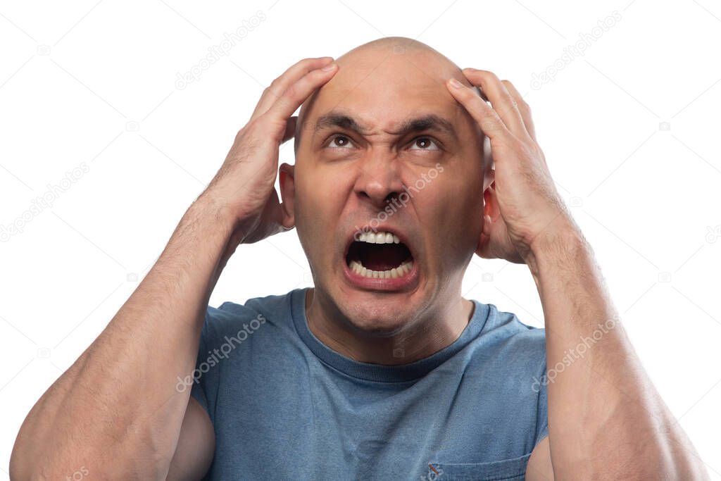Photo of young bald angry screaming man