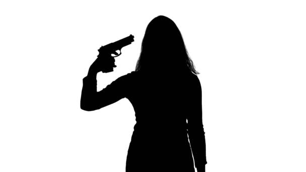 Vídeo de mulheres suicidas silhueta com pistola — Vídeo de Stock