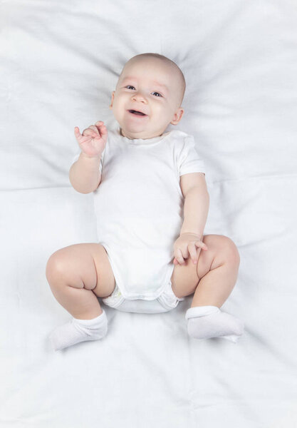 Picture of a six-month-old baby on a white background